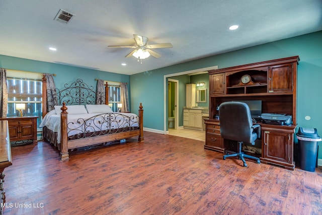 109 Boggs Cir, Long Beach, MS 39560 - bedroom featuring an office area, wood finished floors, ensuite bathroom, recessed lighting, and a ceiling fan