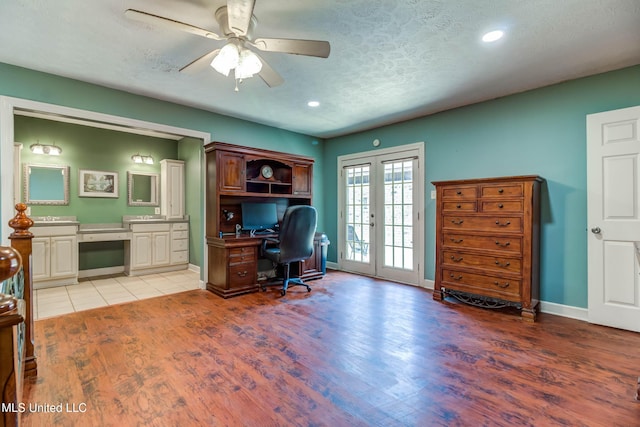 109 Boggs Cir, Long Beach, MS 39560 - office area with light wood finished floors, ceiling fan, a textured ceiling, built in desk, and recessed lighting