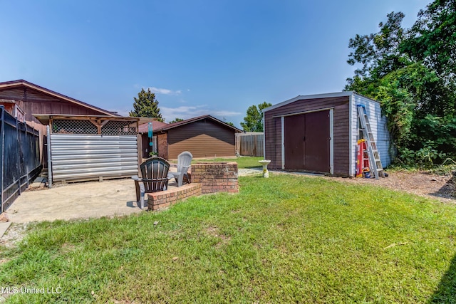 109 Boggs Cir, Long Beach, MS 39560 - view of yard with a storage unit and a patio area