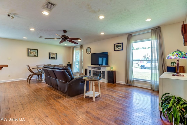 109 Boggs Cir, Long Beach, MS 39560 - living area with wood-type flooring, recessed lighting, ceiling fan, and a textured ceiling