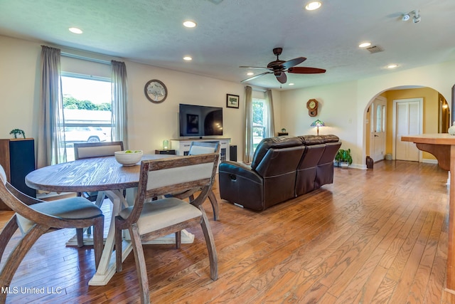 109 Boggs Cir, Long Beach, MS 39560 - dining area featuring arched walkways, light wood-style floors, recessed lighting, and healthy amount of natural light