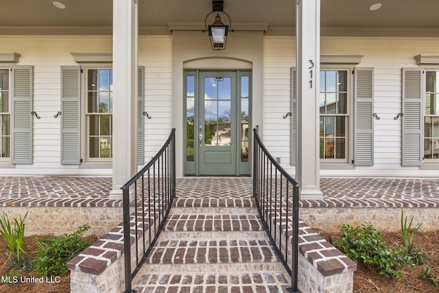 property entrance with covered porch