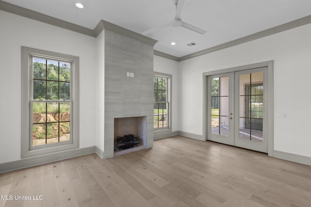unfurnished living room with french doors, ceiling fan, plenty of natural light, light wood-style flooring, and recessed lighting