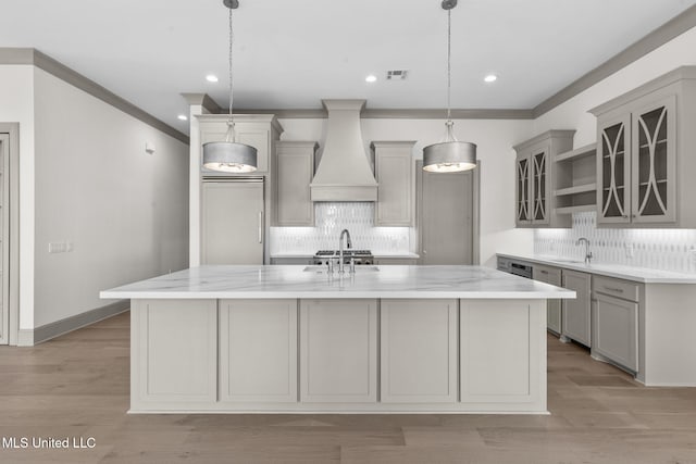 kitchen featuring custom range hood, gray cabinetry, a sink, backsplash, and recessed lighting