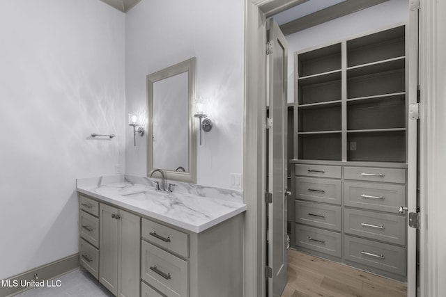 bathroom featuring vanity and wood finished floors