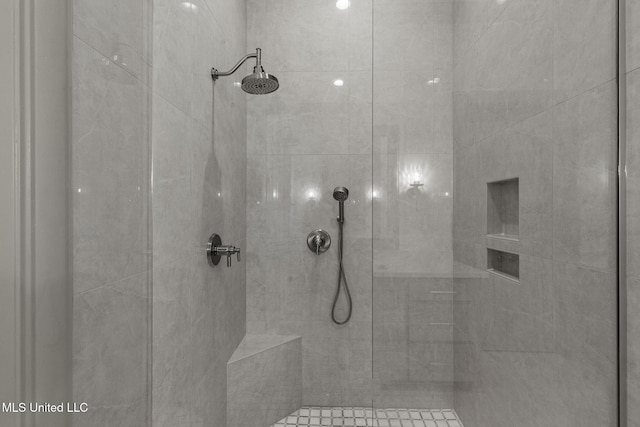 full bathroom with tiled shower