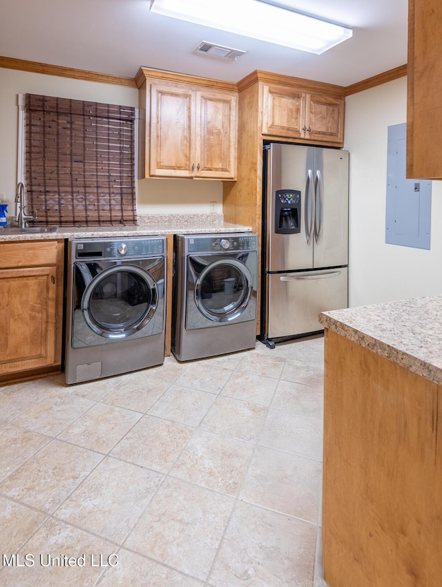 102 Melrose Montebello Pkwy, Natchez, MS 39120 - laundry room with washing machine and clothes dryer, crown molding, and electric panel