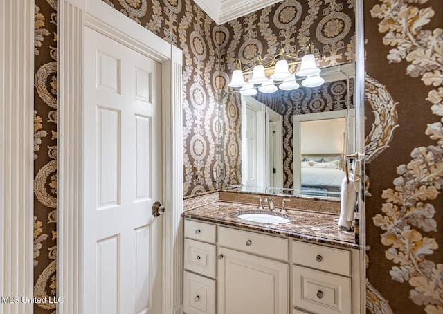 102 Melrose Montebello Pkwy, Natchez, MS 39120 - bathroom with wallpapered walls, vanity, and ornamental molding