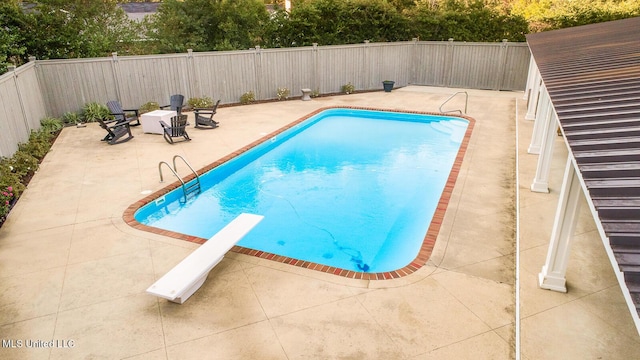102 Melrose Montebello Pkwy, Natchez, MS 39120 - view of swimming pool with a patio area, a fenced backyard, and a diving board