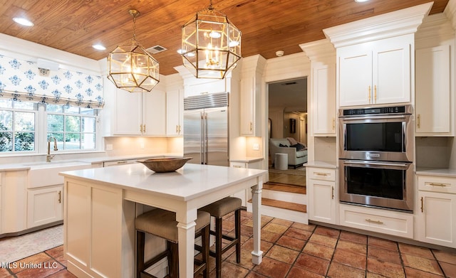 102 Melrose Montebello Pkwy, Natchez, MS 39120 - kitchen with appliances with stainless steel finishes, wood ceiling, light countertops, white cabinetry, and recessed lighting