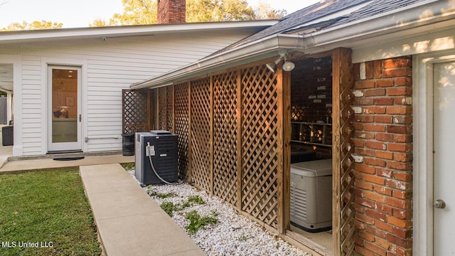 102 Melrose Montebello Pkwy, Natchez, MS 39120 - exterior space with brick siding, a chimney, and roof with shingles