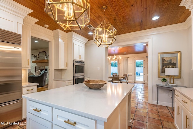 102 Melrose Montebello Pkwy, Natchez, MS 39120 - kitchen with stainless steel appliances, a chandelier, wood ceiling, white cabinets, and light countertops