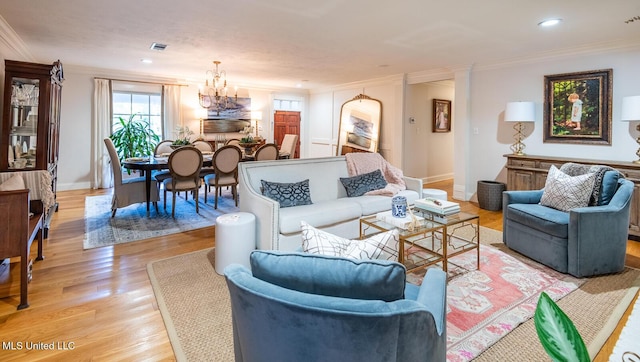102 Melrose Montebello Pkwy, Natchez, MS 39120 - living room with ornamental molding, light wood-style floors, a chandelier, and recessed lighting