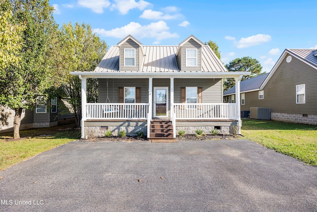 view of front of home with central AC unit, a porch, and a front yard