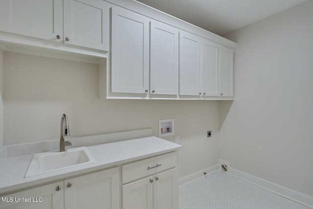 clothes washing area featuring cabinets, sink, hookup for an electric dryer, and hookup for a washing machine