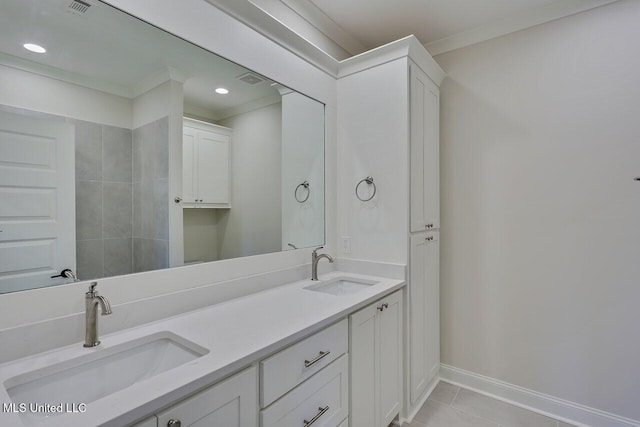 bathroom with tile patterned flooring, vanity, and ornamental molding