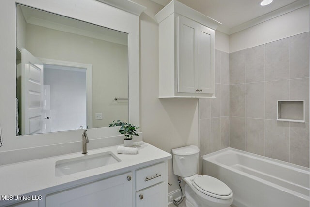 full bathroom featuring toilet, vanity, tiled shower / bath, and crown molding