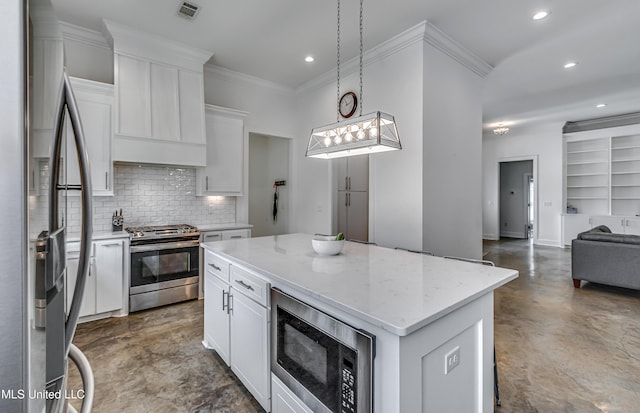 625 Wild Horse Ln, Brandon, MS 39042 - kitchen featuring stainless steel appliances, concrete flooring, recessed lighting, tasteful backsplash, and white cabinetry