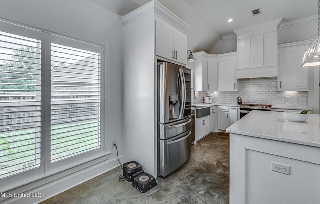 625 Wild Horse Ln, Brandon, MS 39042 - kitchen featuring stainless steel appliances, backsplash, white cabinets, concrete flooring, and light stone counters