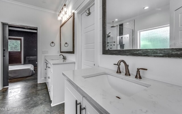625 Wild Horse Ln, Brandon, MS 39042 - bathroom featuring crown molding, tiled shower, two vanities, finished concrete flooring, and connected bathroom
