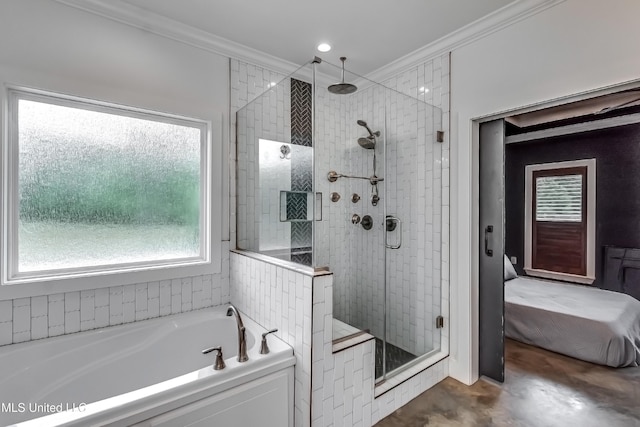 625 Wild Horse Ln, Brandon, MS 39042 - full bath featuring a stall shower, a bath, crown molding, and healthy amount of natural light