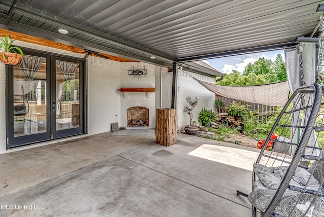 625 Wild Horse Ln, Brandon, MS 39042 - view of patio with french doors and exterior fireplace