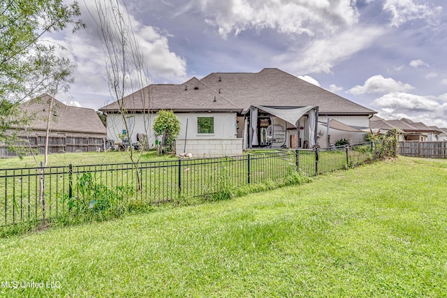 625 Wild Horse Ln, Brandon, MS 39042 - back of house featuring a fenced backyard, roof with shingles, and stucco siding