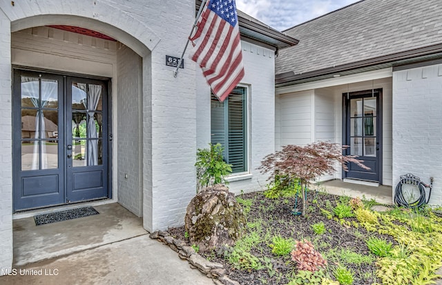 625 Wild Horse Ln, Brandon, MS 39042 - view of exterior entry with french doors, brick siding, and a shingled roof
