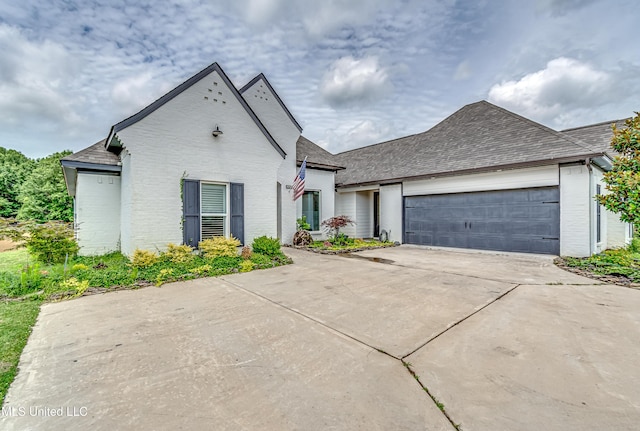 625 Wild Horse Ln, Brandon, MS 39042 - view of front facade featuring concrete driveway, an attached garage, brick siding, and a shingled roof