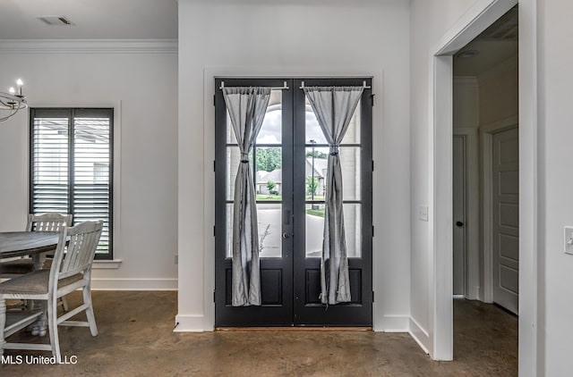 625 Wild Horse Ln, Brandon, MS 39042 - entryway with finished concrete floors, crown molding, french doors, and a chandelier