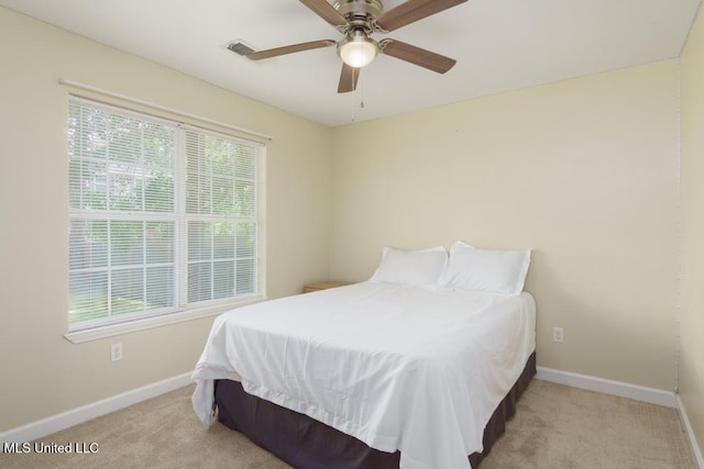 bedroom featuring carpet, baseboards, and ceiling fan