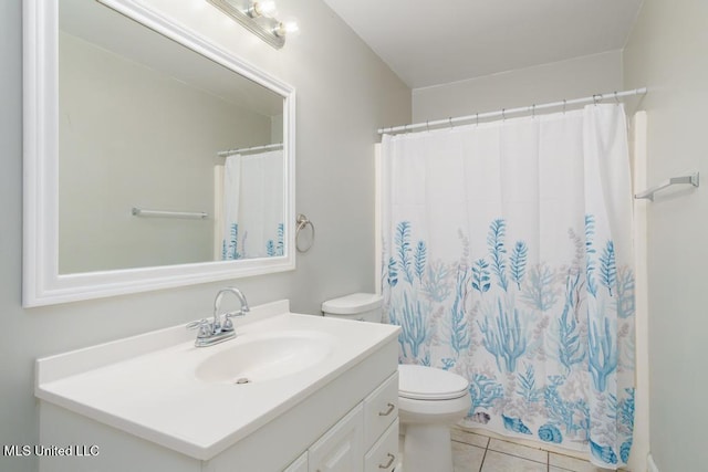 full bathroom featuring toilet, vanity, tile patterned floors, and a shower with shower curtain
