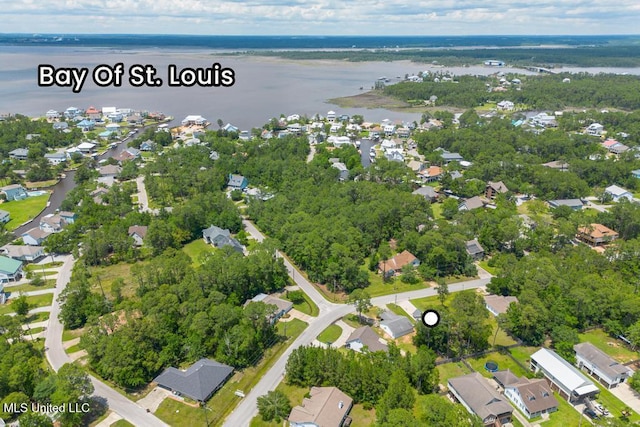 aerial overview of property's location featuring a large body of water and nearby suburban area