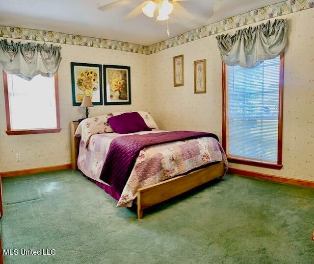 carpeted bedroom with ceiling fan