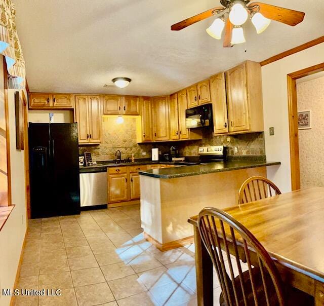 kitchen featuring black appliances, sink, tasteful backsplash, light tile patterned flooring, and kitchen peninsula