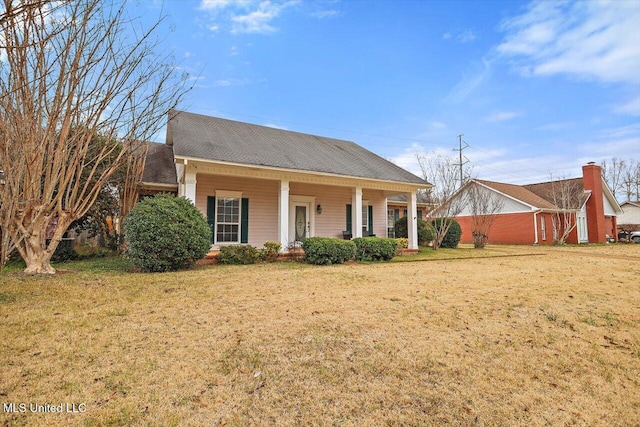 view of front of home featuring a front lawn and covered porch