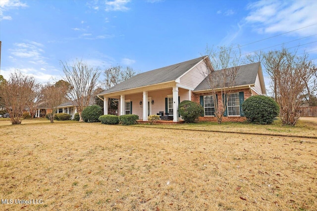 view of front of home with a front yard and a porch