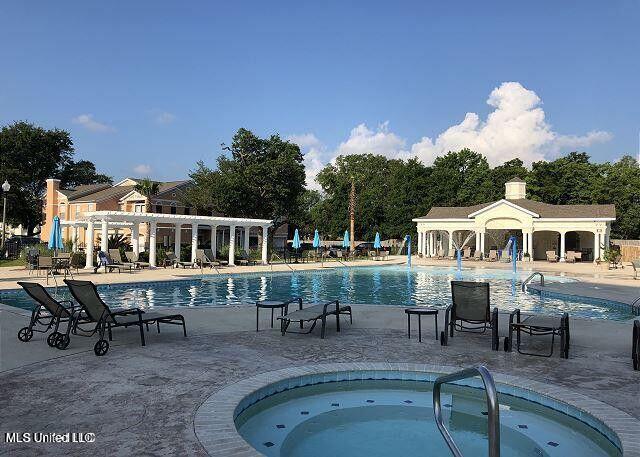 2252 Beach Dr Unit 1704, Gulfport, MS 39501 - community pool with a patio, a community hot tub, and a pergola