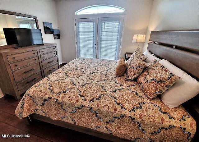 2252 Beach Dr Unit 1704, Gulfport, MS 39501 - bedroom featuring dark wood-style floors