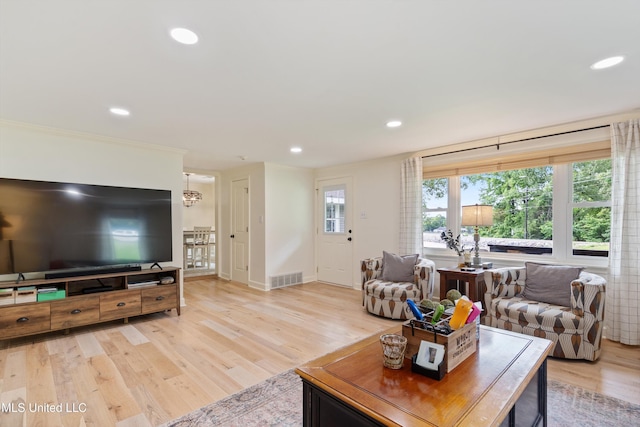 7300 W Shahkoka Dr, Olive Branch, MS 38654 - living area featuring recessed lighting, light wood-type flooring, baseboards, and a chandelier