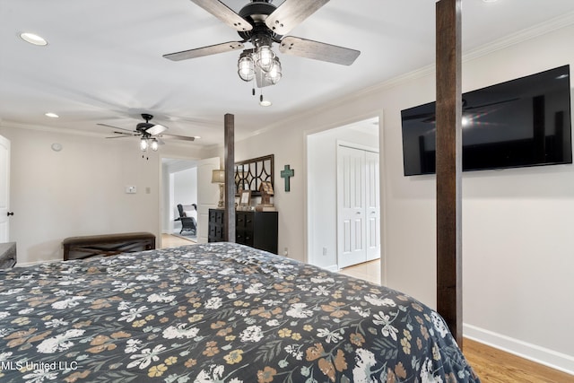 7300 W Shahkoka Dr, Olive Branch, MS 38654 - bedroom with recessed lighting, crown molding, light wood-style floors, a ceiling fan, and baseboards