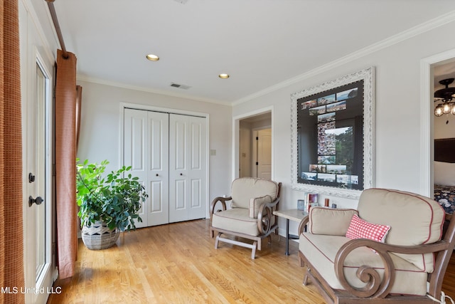 7300 W Shahkoka Dr, Olive Branch, MS 38654 - sitting room with crown molding, light wood-style flooring, and recessed lighting