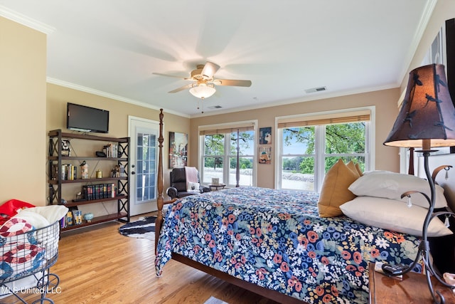 7300 W Shahkoka Dr, Olive Branch, MS 38654 - bedroom featuring access to outside, multiple windows, crown molding, wood finished floors, and a ceiling fan