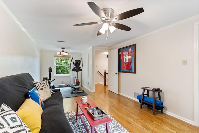 7300 W Shahkoka Dr, Olive Branch, MS 38654 - living area with ornamental molding, light wood-style flooring, a ceiling fan, and baseboards
