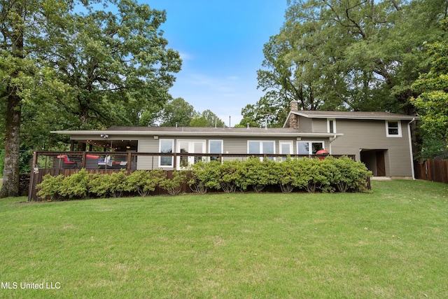 7300 W Shahkoka Dr, Olive Branch, MS 38654 - rear view of house featuring a chimney, a yard, and a deck