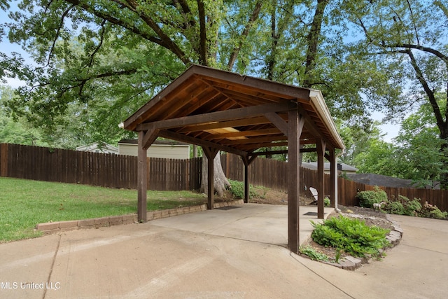 7300 W Shahkoka Dr, Olive Branch, MS 38654 - view of patio / terrace with a detached carport and concrete driveway