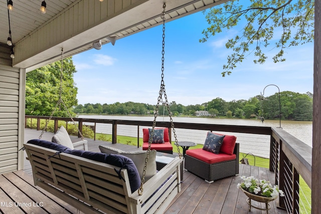 7300 W Shahkoka Dr, Olive Branch, MS 38654 - wooden deck with an outdoor living space and a water view