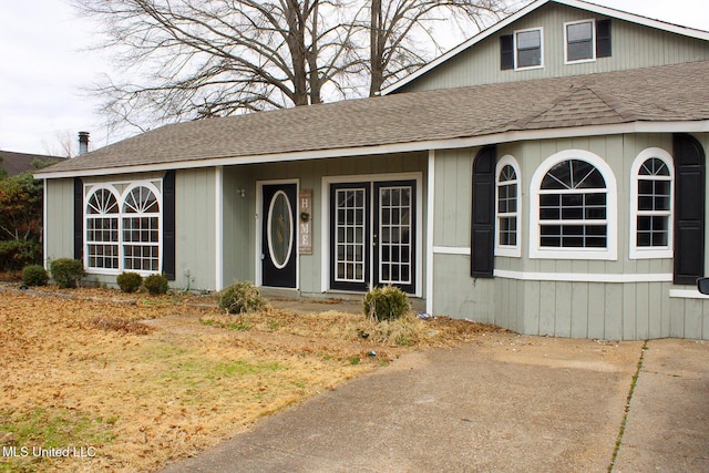 view of front of home with a shingled roof