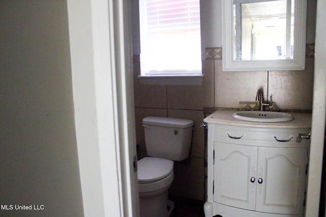 bathroom with toilet and vanity