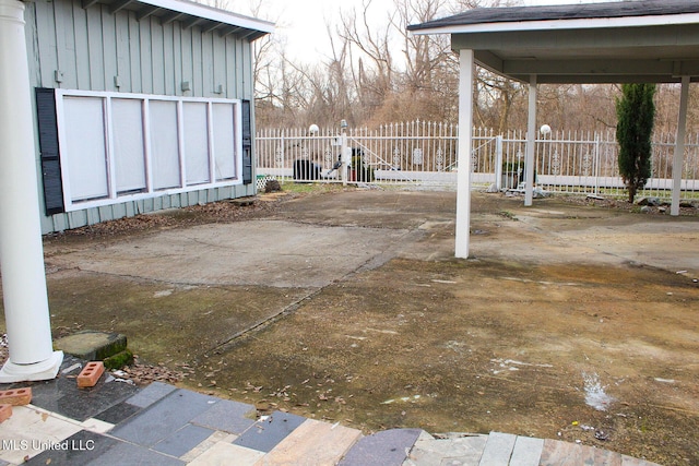 view of patio featuring fence